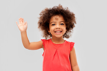 Image showing happy little african american girl waving hand