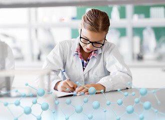 Image showing girl studying chemistry at school laboratory