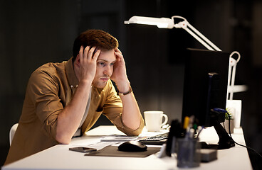 Image showing man with computer working late at night office