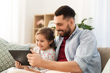 Image showing father and daughter with tablet computer at home