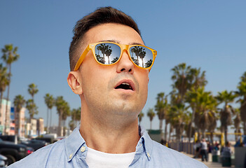 Image showing surprised man in sunglasses over venice beach