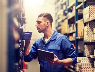 Image showing auto mechanic or smith with tablet pc at workshop