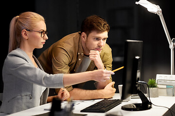 Image showing business team with computer at night office