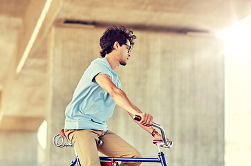 Image showing hipster man riding fixed gear bike