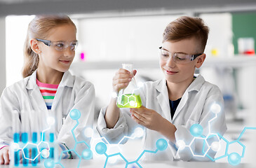 Image showing kids with test tubes studying chemistry at school