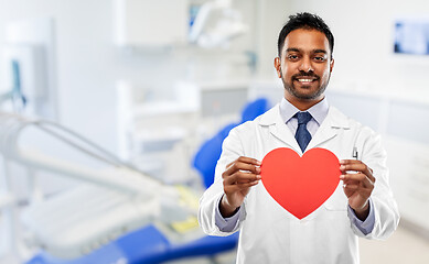 Image showing male dentist with red heart at dental clinic