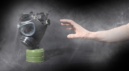 Image showing Man in room filled with smoke, trying to reach for vintage gasma