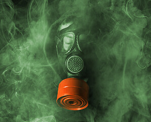 Image showing Man in a gas mask in the smoke