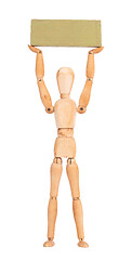 Image showing Wooden mannequin carrying a wooden block