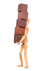 Image showing Wooden mannequin carrying wooden hardwood blocks