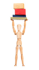 Image showing Wooden mannequin carrying wooden blocks