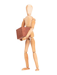 Image showing Wooden mannequin carrying a wooden hardwood block