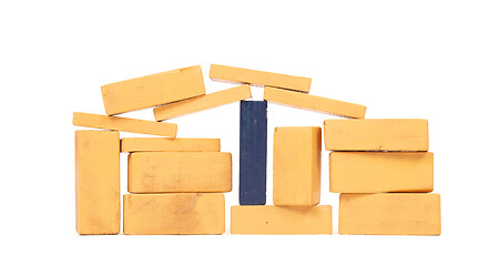 Image showing Vintage orange building blocks isolated on white, one blue one