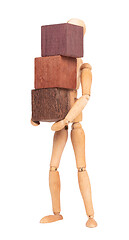 Image showing Wooden mannequin carrying wooden hardwood blocks