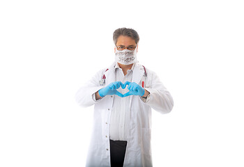 Image showing Doctors gloved hands make a heart symbol