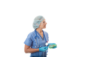 Image showing Hospital nurse or pathologist holding blood test tubes and needl