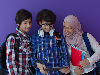 Image showing Arab teenagers group working on laptop  computer together