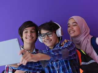 Image showing Arab teenagers group working on laptop  computer together