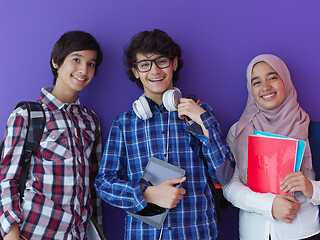 Image showing Arab teenagers group working on laptop  computer together