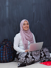 Image showing arab female student working on laptop