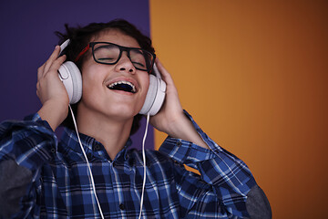 Image showing Teenage Boy Wearing Headphones And Listening To Music