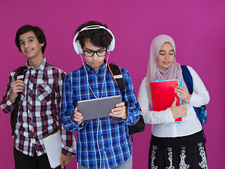 Image showing Arab teenagers group working on laptop  computer together