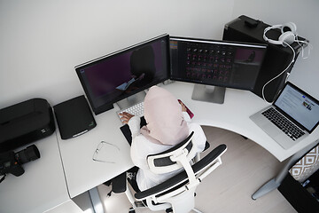 Image showing Arabic creative professional  working at home office top view