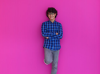 Image showing portrait  of smart looking arab teenager  against pink backgroun