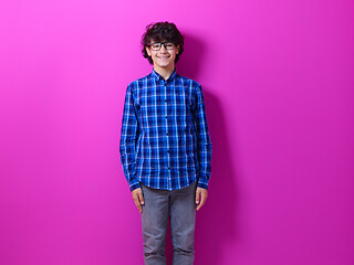 Image showing portrait  of smart looking arab teenager  against pink backgroun