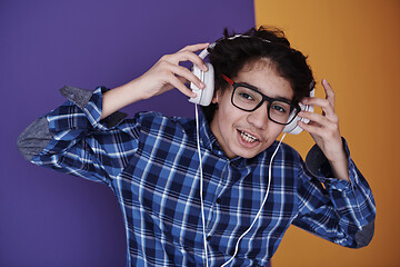 Image showing Teenage Boy Wearing Headphones And Listening To Music