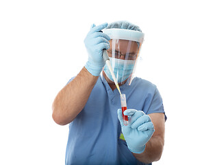 Image showing Healthcare worker pipetting a patient sample