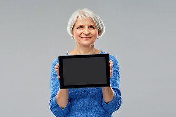 Image showing senior woman using tablet computer