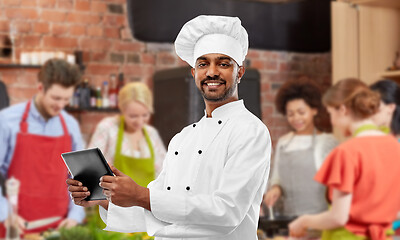 Image showing male indian chef with tablet pc at cooking class