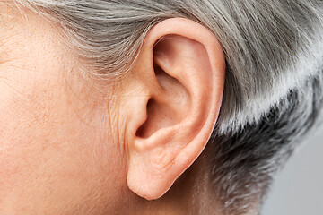 Image showing close up of senior woman ear