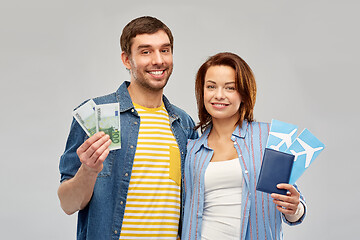 Image showing couple with air tickets, passport and money