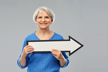 Image showing smiling senior woman with big rightwards arrow