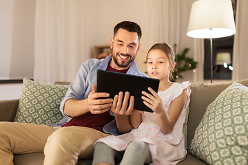 Image showing father and daughter with tablet computer at home