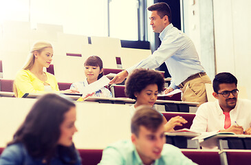 Image showing teacher giving test to students on lecture