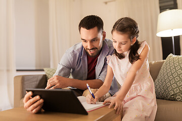 Image showing father and daughter doing homework together