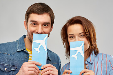 Image showing happy couple with air tickets