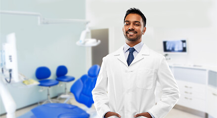 Image showing indian male dentist in white coat at dental clinic