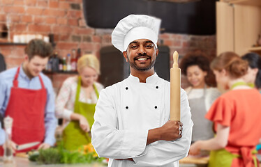 Image showing male indian chef with rolling-pin at cooking class