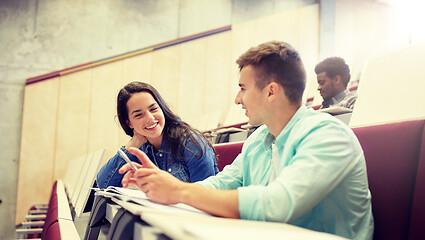 Image showing group of students with notebooks at lecture hall