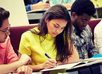 Image showing group of international students writing at lecture