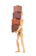 Image showing Wooden mannequin carrying wooden hardwood blocks