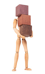 Image showing Wooden mannequin carrying wooden hardwood blocks