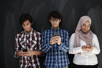 Image showing arab teenagers group using smart phones for social media network
