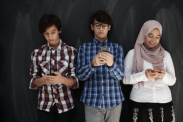 Image showing arab teenagers group using smart phones for social media network