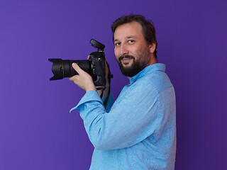 Image showing Portrait of  male Photographer purple background