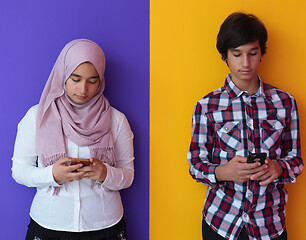 Image showing arab teenagers group using smart phones online education